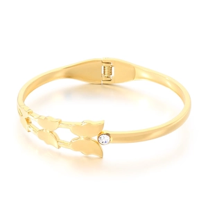 Minimalist 18K gold butterfly bangle with crystal accents on a clean white background