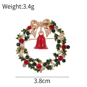 Broche couronne de Noël exquise avec nœud doré et cloche rouge pour les tenues