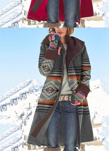 Detailed pattern on long floral coat with ethnic geometric print and embroidered gloves