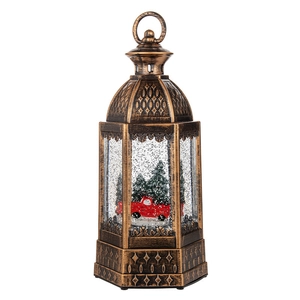 Vintage bronze Christmas lantern with red truck scene and swirling snow glitters