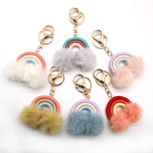 Handmade bohemian rainbow keychains with colorful plush pom poms and gold lobster clasps