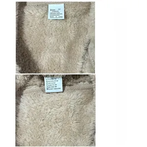 Detail shot of the internal care label and size tag on beige polar fleece jacket