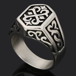 Macro shot of Viking Thor's Hammer ring showing detailed floral engravings on vintage steel