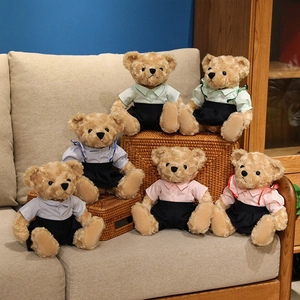 Set of six cuddly teddy bears in colorful outfits on a cozy sofa setting