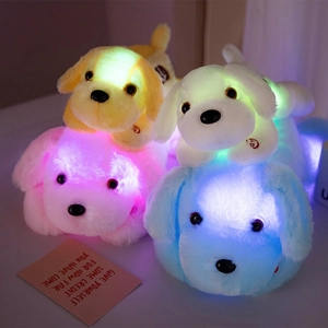 Luminous plush dog toys in yellow white pink and blue glowing in soft colorful LED light