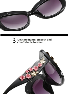 Detail of baroque style sunglasses with floral relief carving and gradient lenses