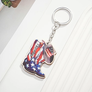 Customized wooden cowboy boot and hat keychain with American flag design and metal ring