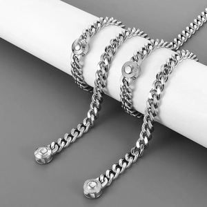 Triple silver 10mm CNC iced out Cuban chains on display for hip hop jewelry style