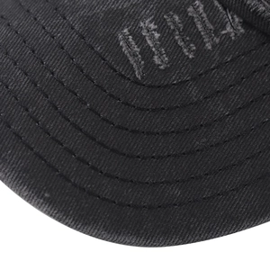 Detailed close-up of high-density canvas baseball cap with vintage distressed embroidery