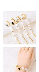 Close-up of gold titanium jewelry set with natural pearls and moon star eye pendants