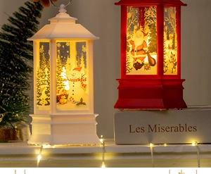 Detail of vintage Christmas lanterns with Santa and Snowman patterns in warm ambient light