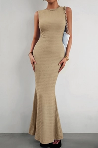 Detail showing the pleated texture fabric and elegant mermaid hem of this khaki dress