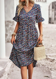 Detail of V-neck floral print dress with ruffle sleeves and high waist design