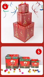 Detail view of festive red Christmas gift boxes with gold reindeer and tree patterns