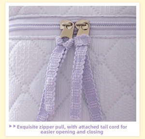 Detail of light purple quilted makeup bag with double metal zippers and fabric pullers