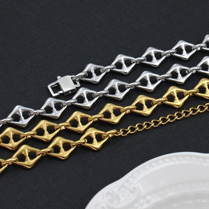 Detail of geometric rhombus link necklaces in gold and silver finish with lobster clasp