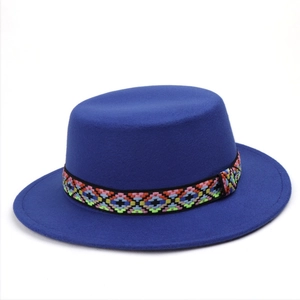 Detail of navy wool felt fedora featuring an ethnic geometric embroidered ribbon band