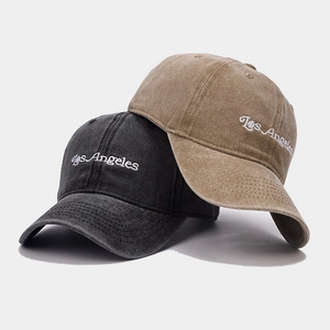 Detail view of cotton baseball caps with Los Angeles embroidery and washed vintage texture