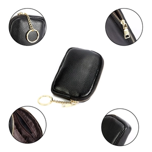 Black genuine leather coin purse with gold zipper, keychain, and detailed view inserts