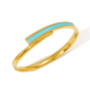 Detail of 18K gold plated stainless steel bangle with turquoise enamel inlay and clasp