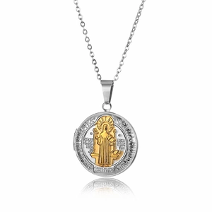 Detailed macro view of two-tone Saint Benedict medal pendant with a sturdy silver chain
