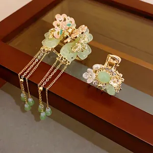 Vintage floral hair claw set with pearls, green jade-like accents, and long tassels