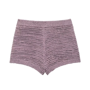 Close-up of purple knit shorts showing the unique wavy 3D texture and premium fabric details