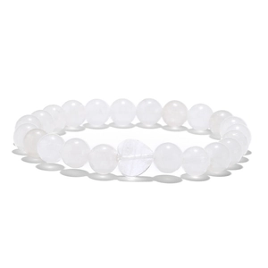 Close-up of translucent white beaded bracelet with a smooth heart-shaped stone charm