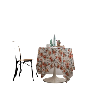 Christmas velvet tablecloth with poinsettia floral print on round dining table