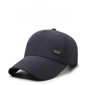 Detail of dark grey breathable baseball cap with laser-cut side vents and metal logo plate