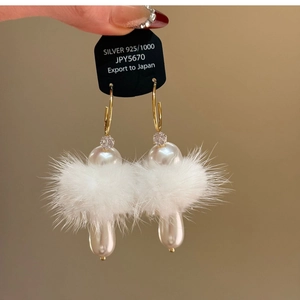 Elegant gold C-shaped earrings with white pearls and soft faux fur for women