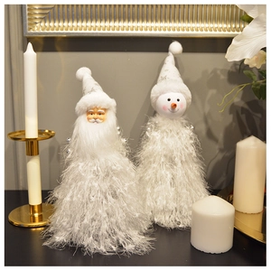 Detail of plush Santa and Snowman cone figurines with white faux fur on a festive table
