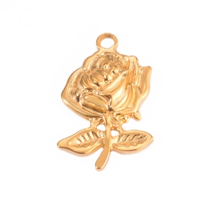 Detailed view of a golden rose pendant with stem and leaf for DIY jewelry making