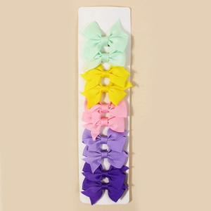Close-up of 10-piece colorful grosgrain ribbon hair bows on a display card