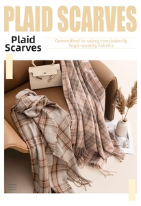 Detail of plaid scarf texture with tassels in brown and pink on a leather chair