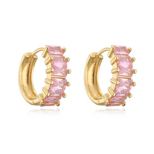 Macro view of 18K gold plated earrings with pink baguette-cut zirconia inlay