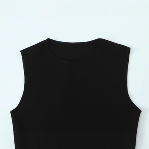 Sleeveless black crew neck top with patchwork detail on white background