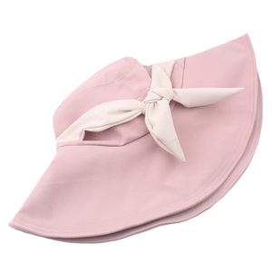 Cappello da sole rosa a tesa larga da donna con fiocco crema per la protezione solare