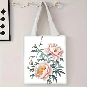 Détail d'un sac cabas en toile blanche avec grand imprimé de pivoine rose et feuilles vertes