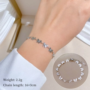 Detail of silver butterfly chain bracelet showing 16+3cm length and 2.2g weight specs