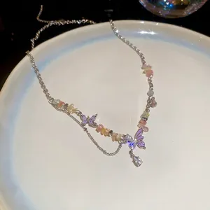 Colorful crushed stone heart necklace with purple butterfly pendant and pear-shaped crystal
