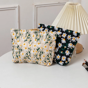 Floral daisy embroidered makeup bags in beige and black, large capacity cotton canvas pouch