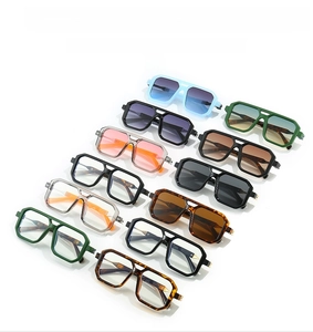 Detailed array of vintage double-bridge sunglasses in diverse colors on white background