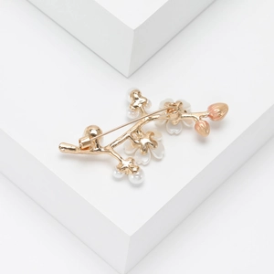 Elegant plum blossom branch brooch with shell flowers and pearls on geometric blocks