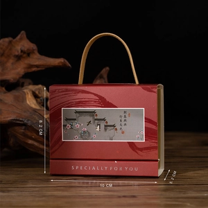 Detail of red Chinese wedding gift box with gold rope handles and 10x8.2x5.2 CM dimensions