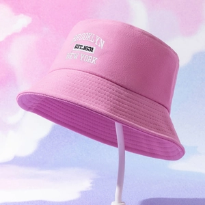 Detailed white embroidery of Brooklyn New York logo on a pink sun bucket hat