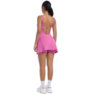 Back view of a rose pink tennis dress with an open-back design and built-in shorts