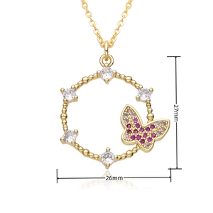Detailed view of gold butterfly pendant with dimensions 27mm by 26mm on white background