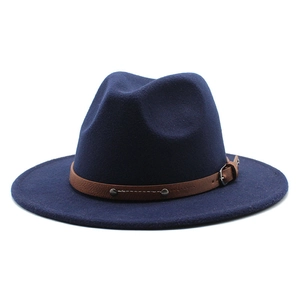 Detailed texture of dark blue felt fedora hat featuring a brown faux leather buckle belt