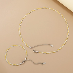 Detailed view of two-tone braided snake chain set with adjustable lobster clasp